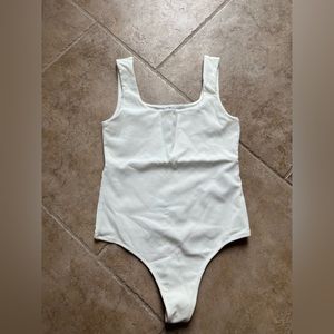 Cotton on white body suit